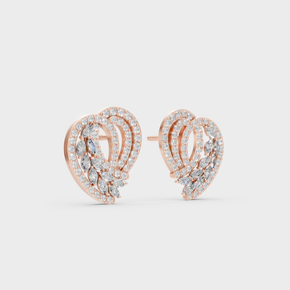 Warm light refracting through Round Marquise Sustainable Diamond Stud Earrings in 18K Rose Gold.