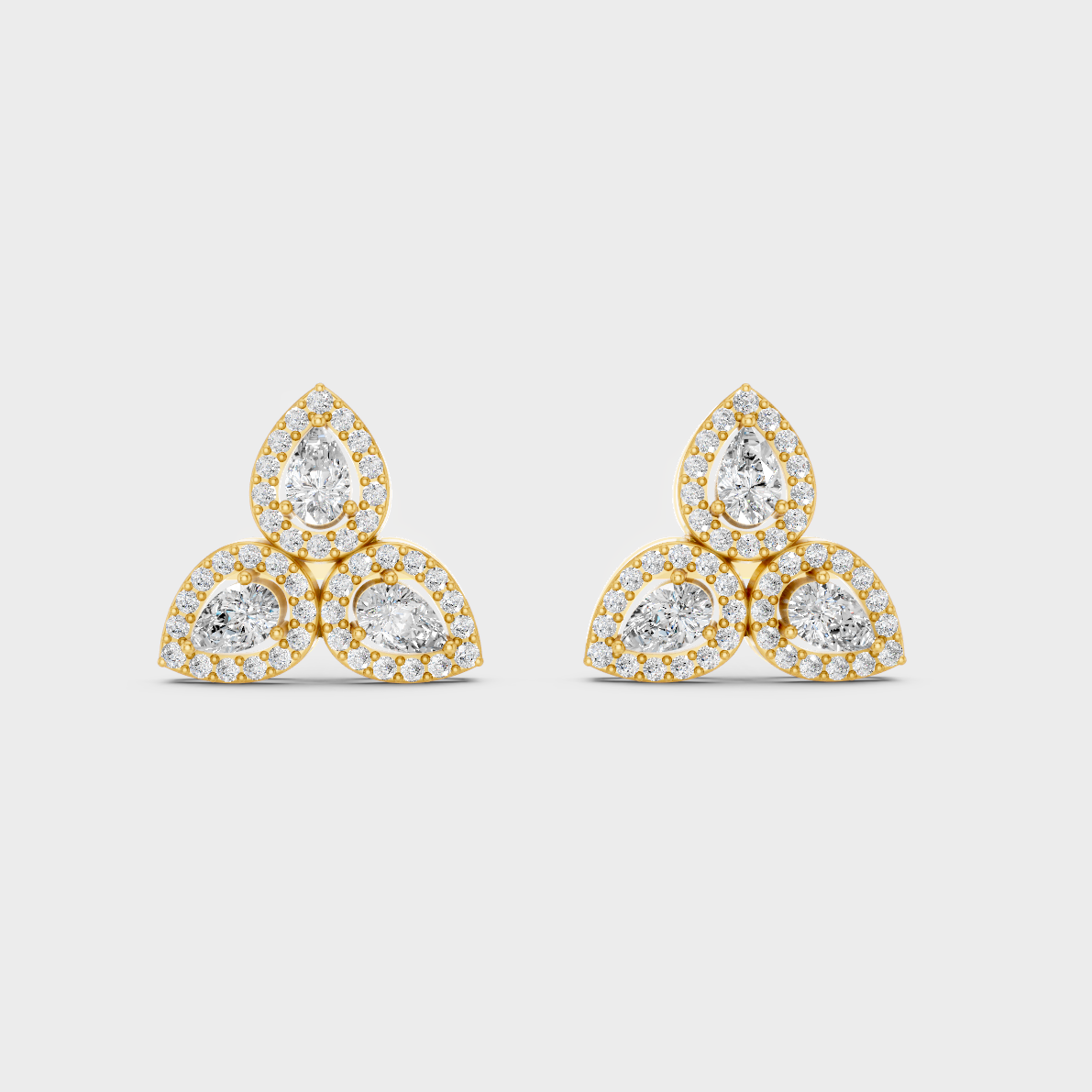 On-model ear wearing a pair of 0.96ct Round and Pear Lab Diamond Stud Earrings in classic 9K Yellow Gold.