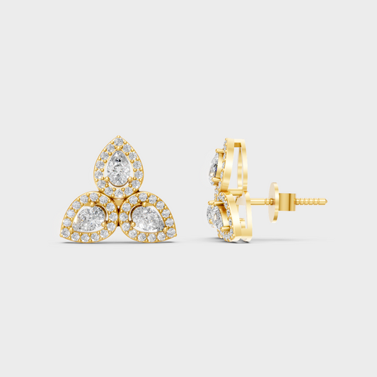 Close-up shot of 0.96 Carat Round and Pear Cut Lab-Grown Diamond Stud Earrings set in warm 14K Yellow Gold.