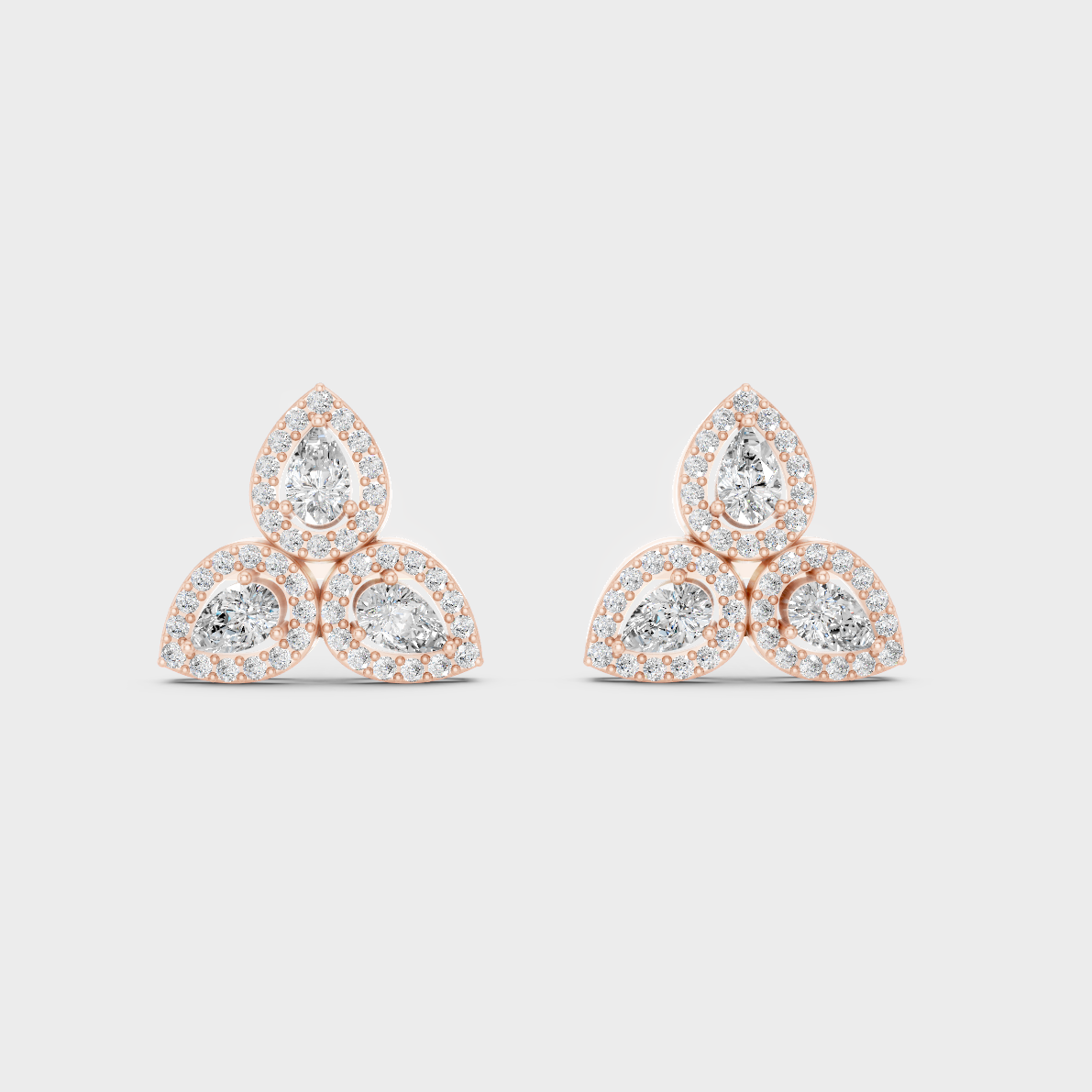 Top-down view displaying the Brilliant Sparkle of 0.96ct Round and Pear Diamond Studs in 9K Rose Gold.