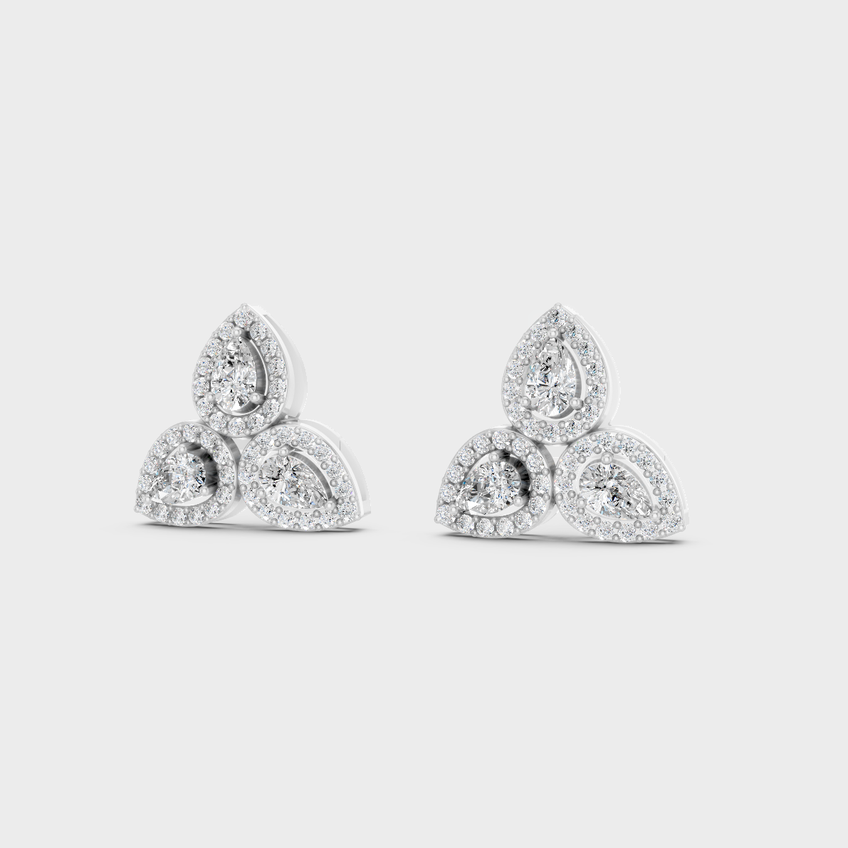 Frontal view of Ethical Luxury Studs featuring Round and Pear Cut Lab Diamonds set in 14K White Gold.