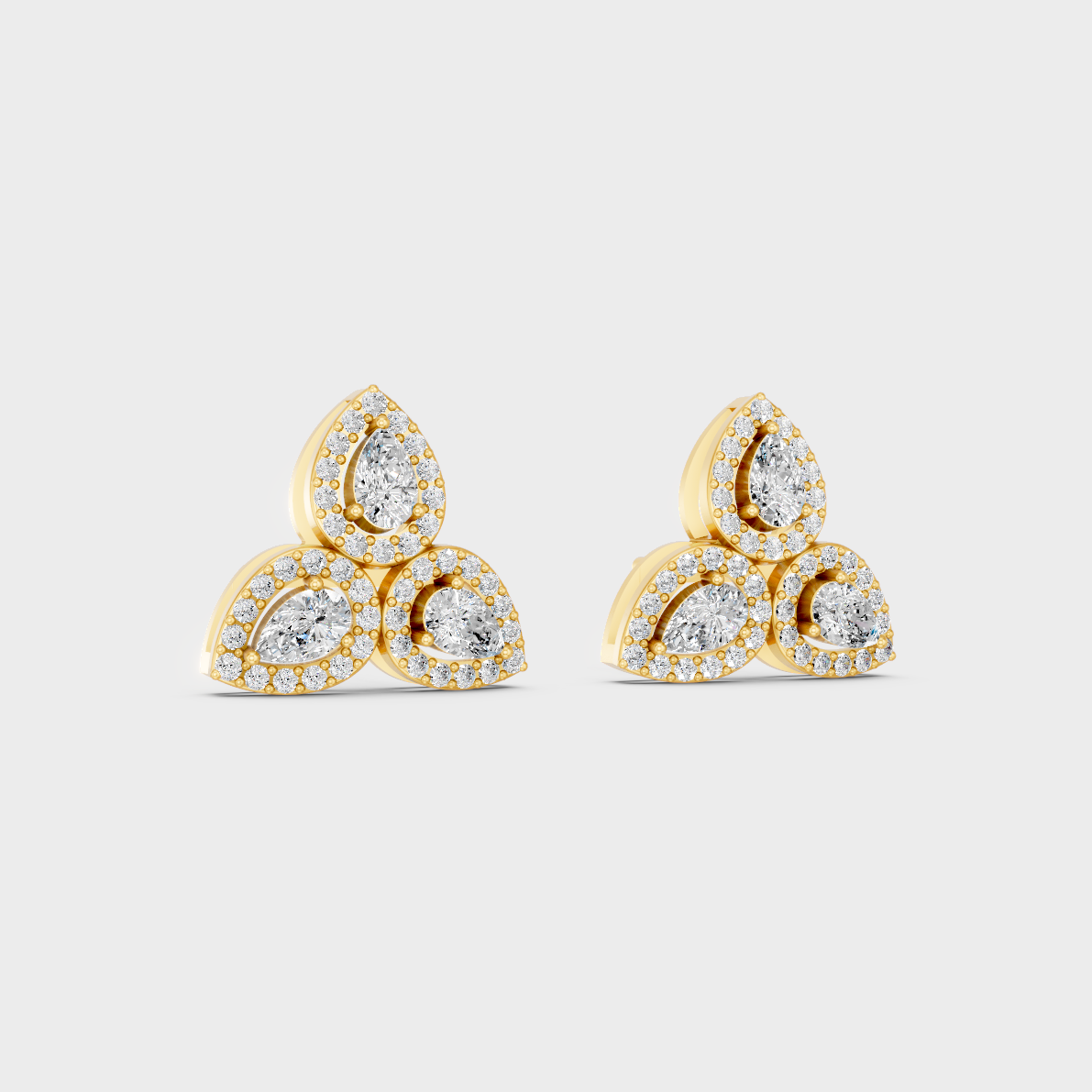 Macro studio lighting catching the fire of Sustainable Mixed Cut Lab Diamond Stud Earrings in 18K Yellow Gold.