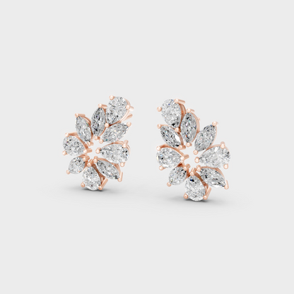 Pair of Ethical Luxury Marquise and Pear Diamond Studs glowing on a rose-hued 18K Rose Gold Setting.