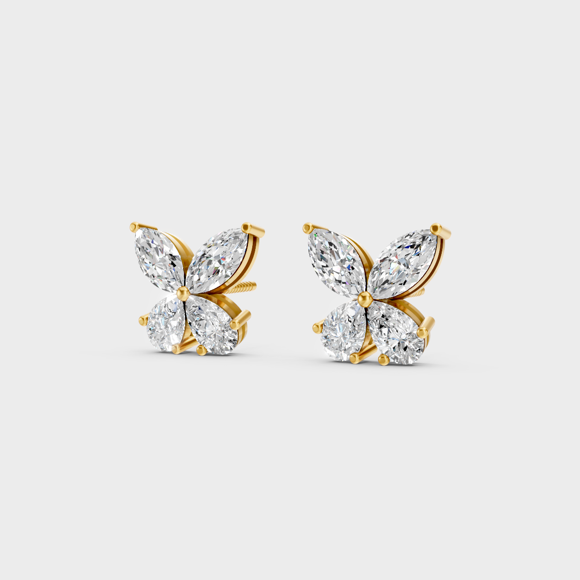 Side angle showing the secure backing and Brilliant Sparkle of Ethical Luxury Marquise and Pear Studs in 18K Yellow Gold.