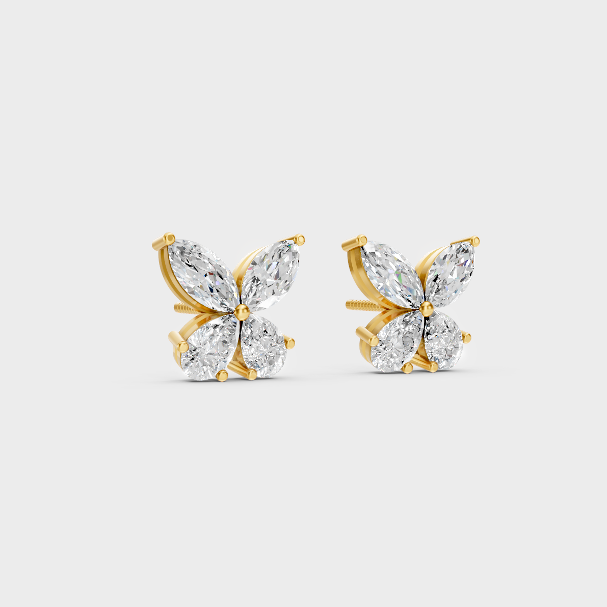 Macro studio lighting catching the fire of Sustainable Mixed Cut Lab Diamond Stud Earrings in 18K Yellow Gold.