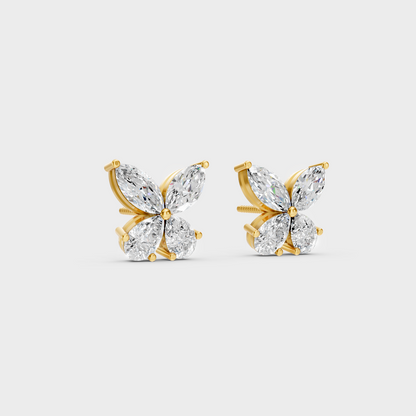 Macro studio lighting catching the fire of Sustainable Mixed Cut Lab Diamond Stud Earrings in 18K Yellow Gold.