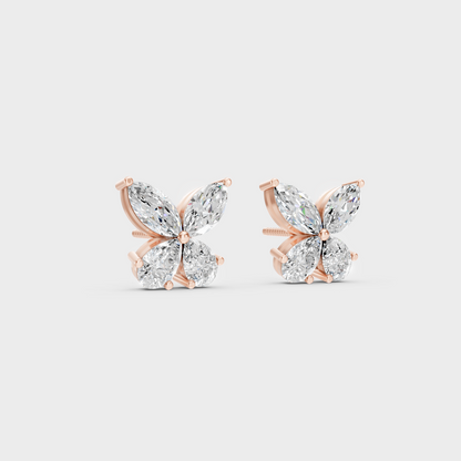 Warm light refracting through Marquise Pear Sustainable Diamond Stud Earrings in 18K Rose Gold.