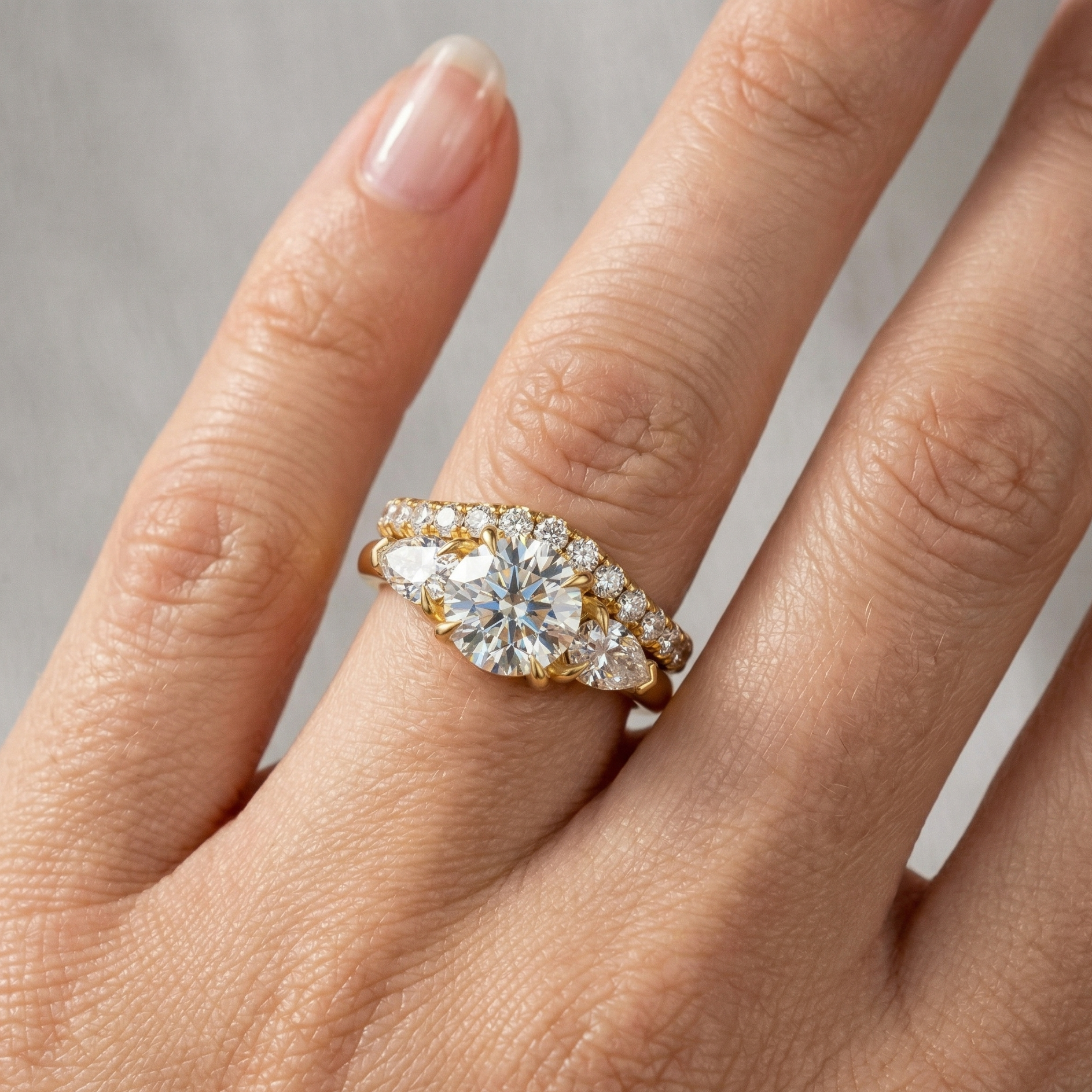 Gold and diamond ring on a hand 