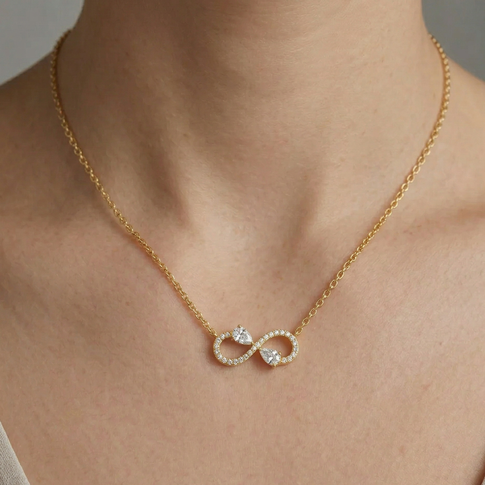 Classic 14K Yellow Gold Infinity Necklace Featuring A Pear Lab Diamond