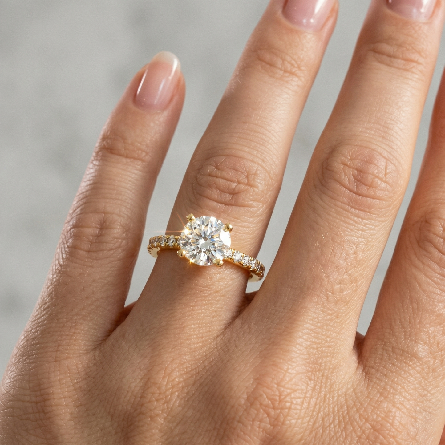 Yellow Gold ring with a large diamond on a hand 
