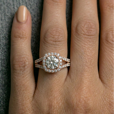 Rose Gold Ring Featuring A Round Center Stone in Halo
