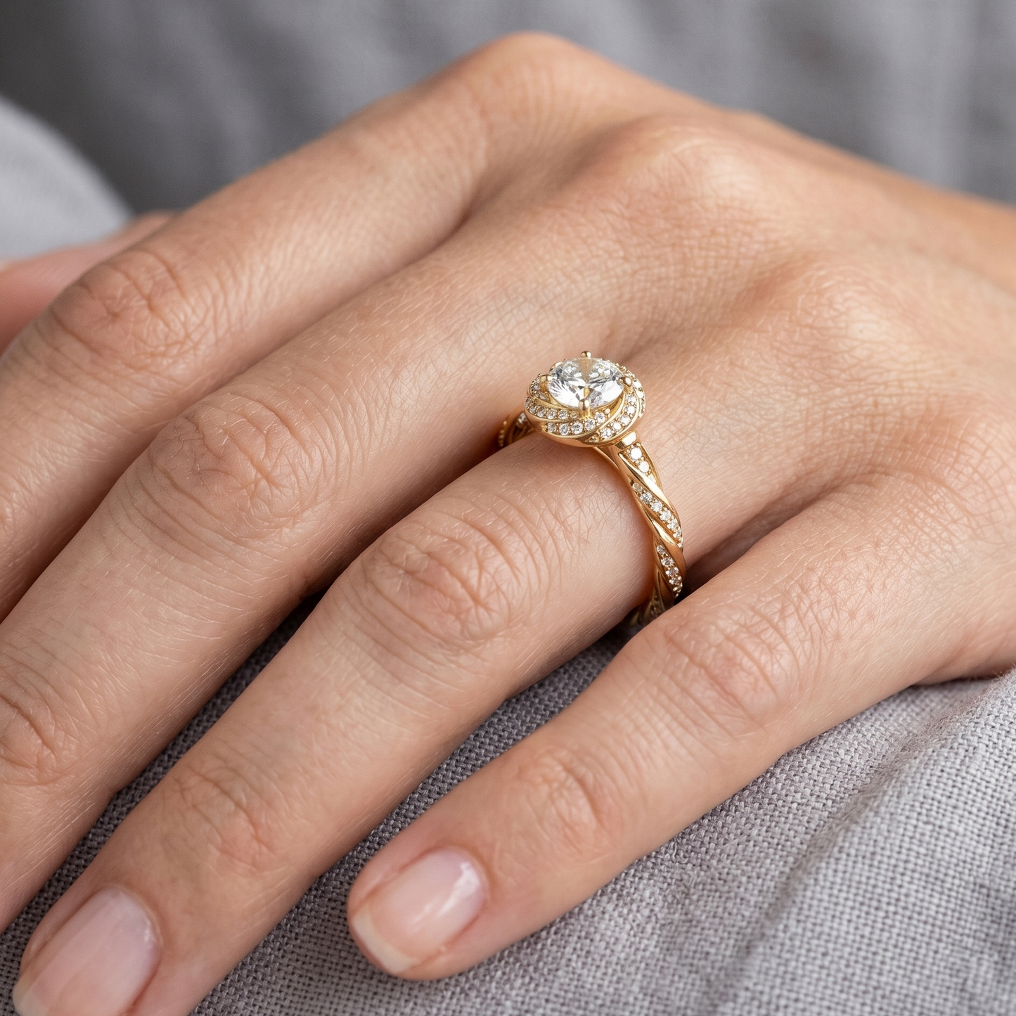 Yellow Gold Engagement Ring Featuring A Round Diamond With Twist Band And Halo