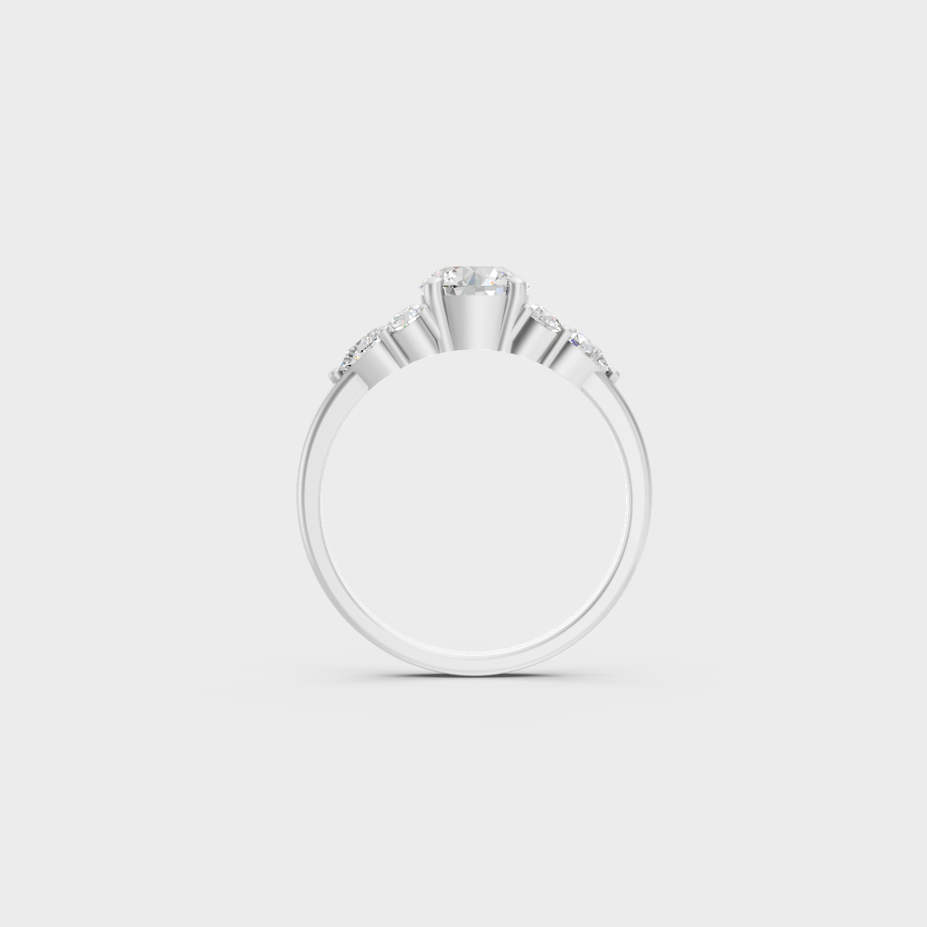 White Gold Round Proposal Ring With Brilliant Pear Side Stones