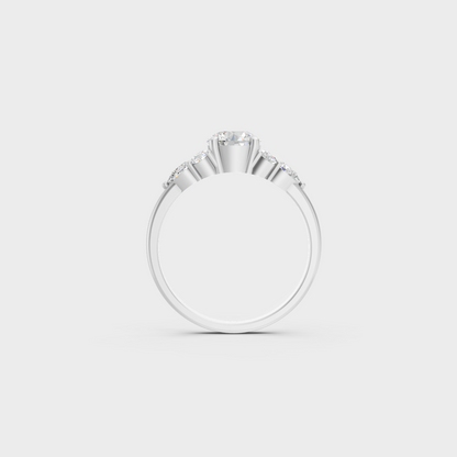 White Gold Round Proposal Ring With Brilliant Pear Side Stones