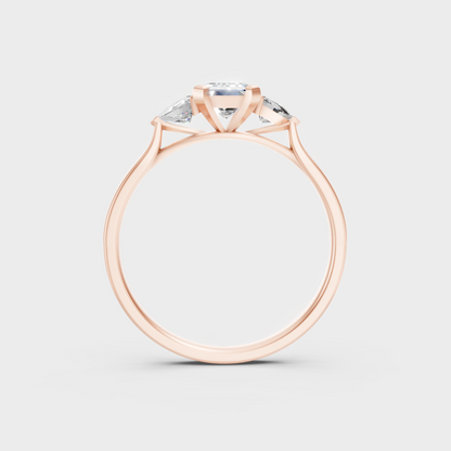 Unique Rose Gold Ring Featuring A Igi Certified Emerald Cut And Trillion Side Stones