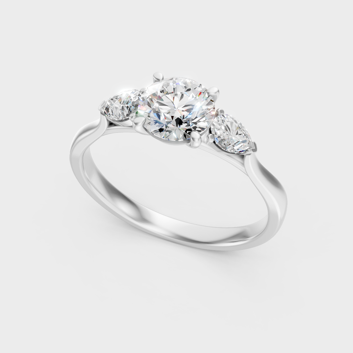 Sleek 18K White Gold Engagement Ring Featuring A 1.50Ct Round And Pear Trio