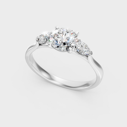 Sleek 18K White Gold Engagement Ring Featuring A 1.50Ct Round And Pear Trio