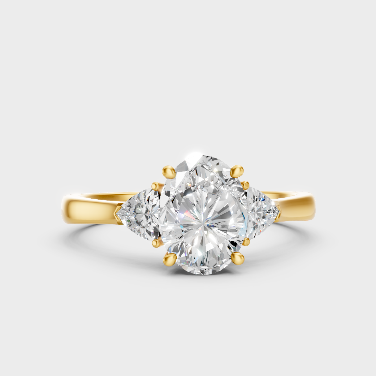 Classic Yellow Gold Three-Stone Engagement Ring Featuring An Oval Cut And Trillions