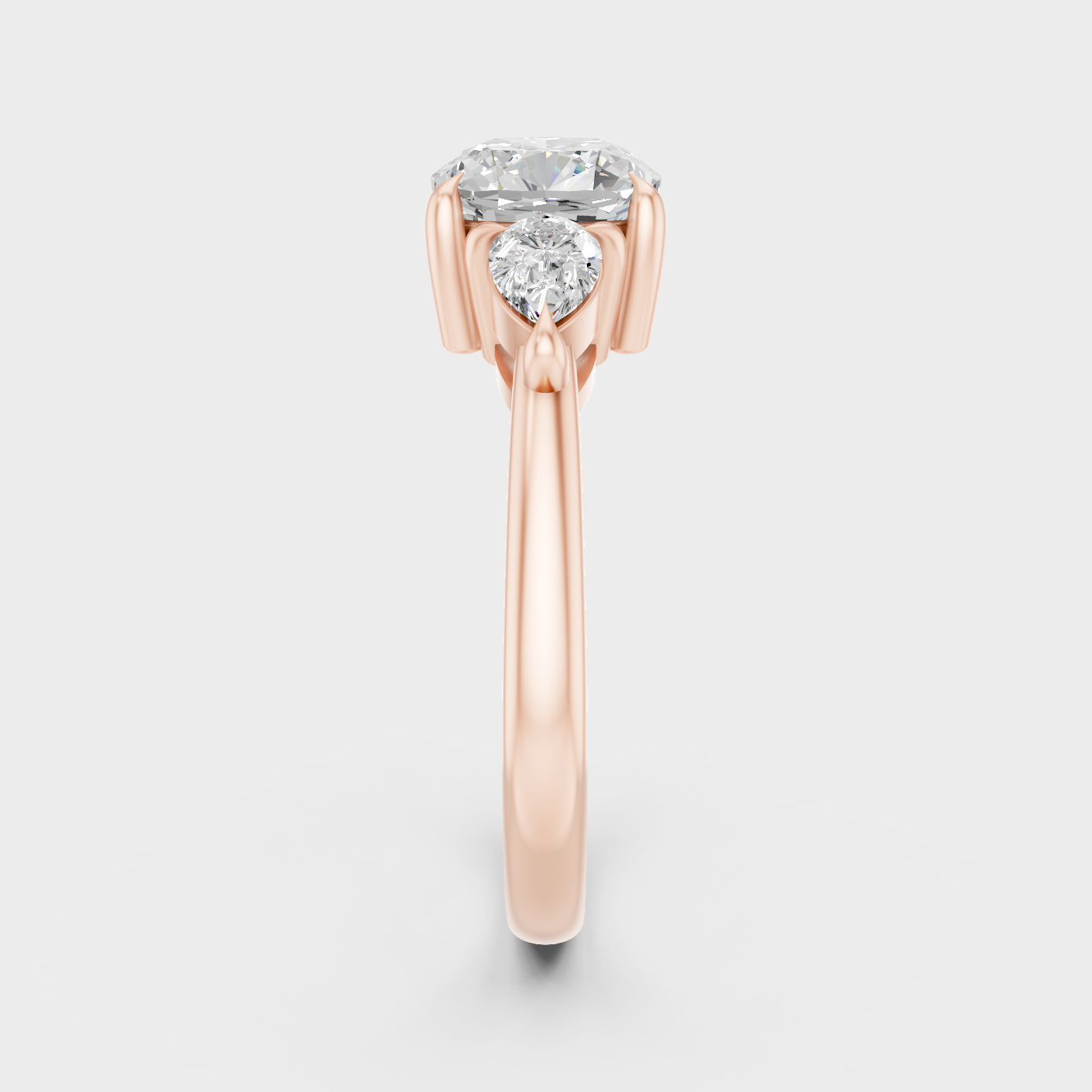 Three Stone Ring In Rose Gold With Cushion And Pear Diamonds