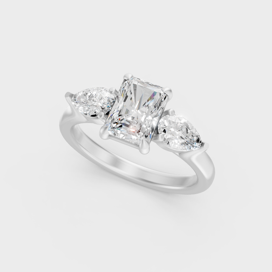 Platinum Radiant And Pear Cut Three Stone Ring Timeless Elegance