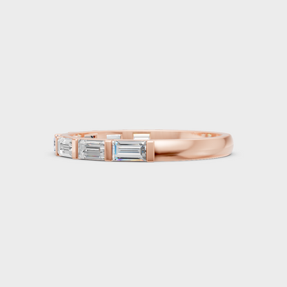 Blush rose gold eternity band with hallmarked baguette-cut sustainable diamonds