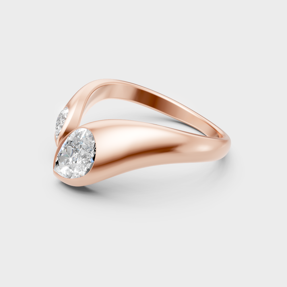 Modern rose gold solitaire ring with a brilliant sustainable pear diamond