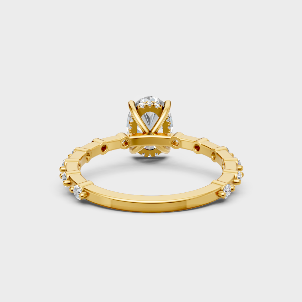 Premium yellow gold solitaire showcasing a oval and round-cut lab diamond