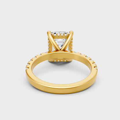 Customizable Yellow Gold Hidden Halo Ring Showcasing A 4.30 Carat Emerald Diamond