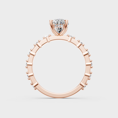 Modern rose gold solitaire ring with a brilliant sustainable oval diamond