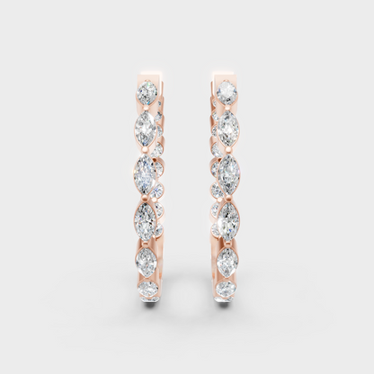 Unique rose gold diamond hoops featuring a blend of marquise and round-cut stones