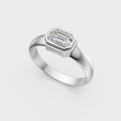 Sleek 18K white gold solitaire ring featuring an IGI-certified emerald-cut diamond