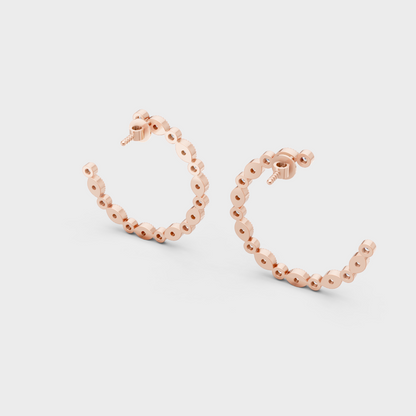 Rose gold and round-cut lab-grown diamond earrings for a soft, modern look.