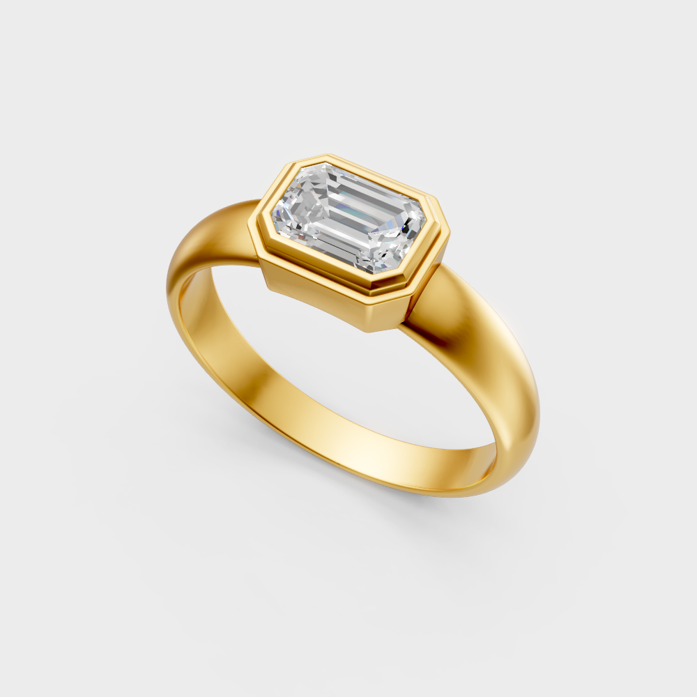 Classic 14K yellow gold engagement ring featuring a sustainable emerald-cut diamond