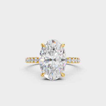 Certified 4.62 Ct oval and round cut lab-grown diamond hidden halo ring in 18K yellow gold.
