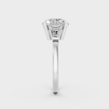 IGI certified 3.32 Ct round and baguette cut lab-grown diamond three-stone ring in 18K white gold.