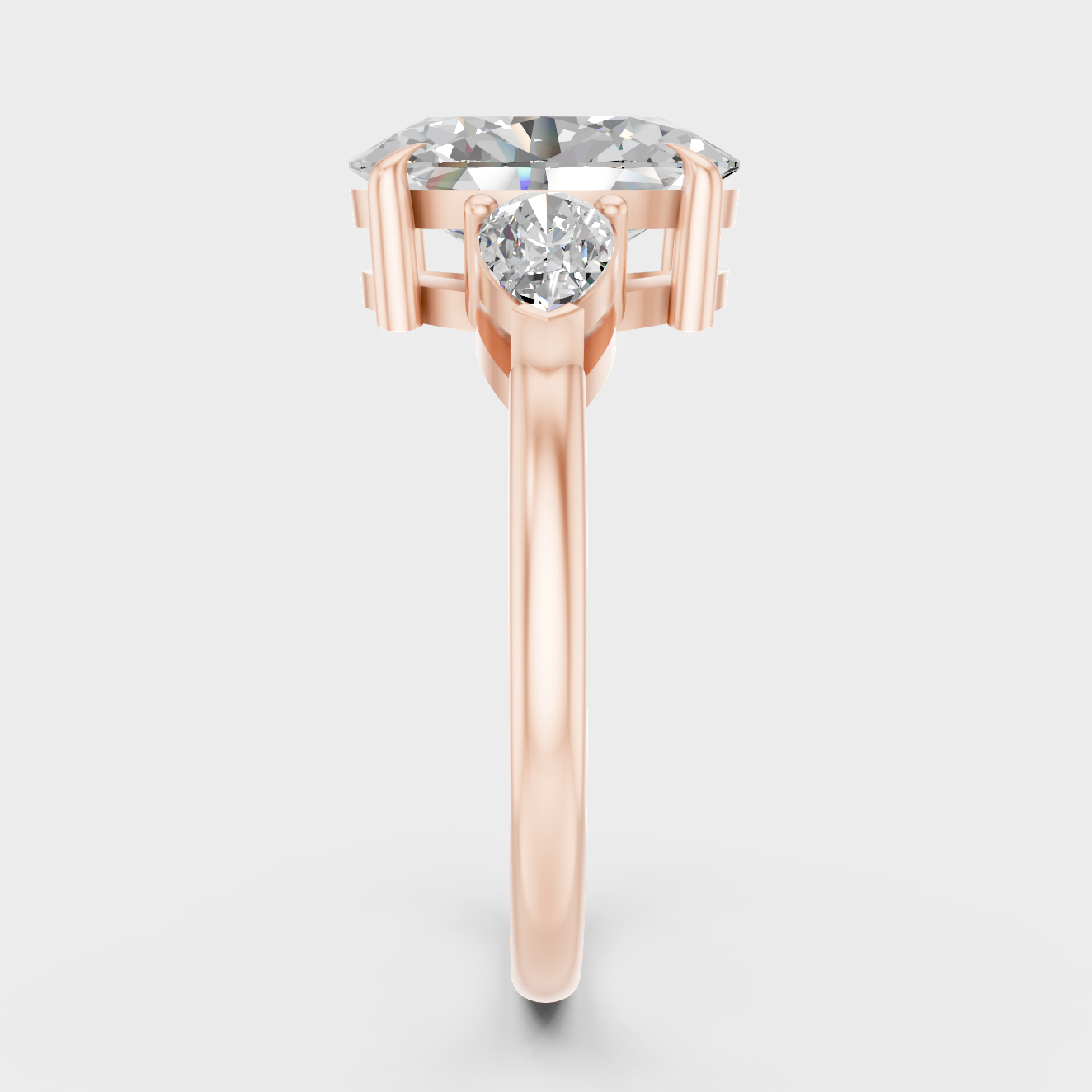 Three Stone Ring In Rose Gold With Oval And Pear Diamonds
