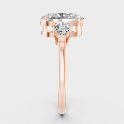Three Stone Ring In Rose Gold With Oval And Pear Diamonds