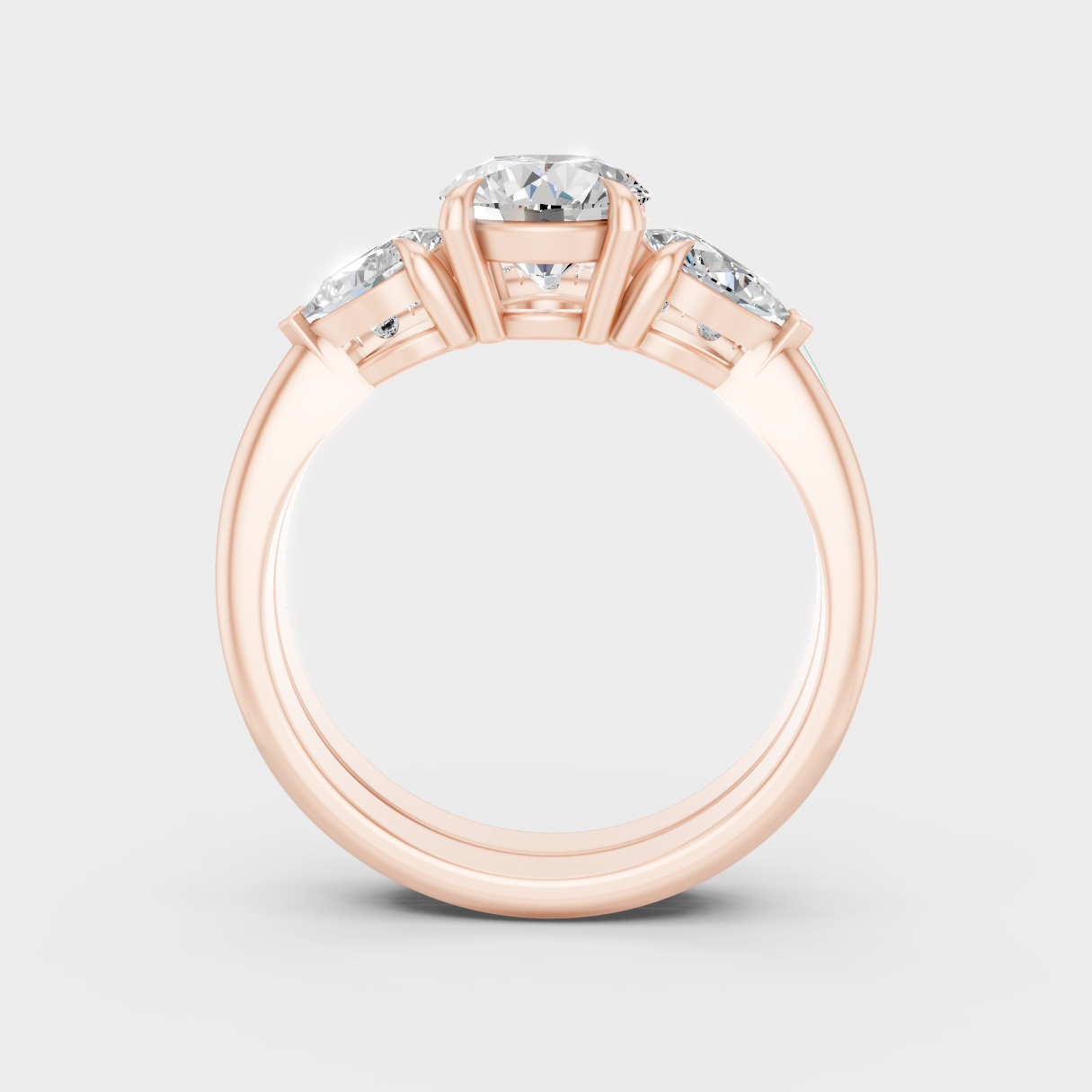 Blush Rose Gold Ring Set With Hallmarked Round And Pear Diamond Detail