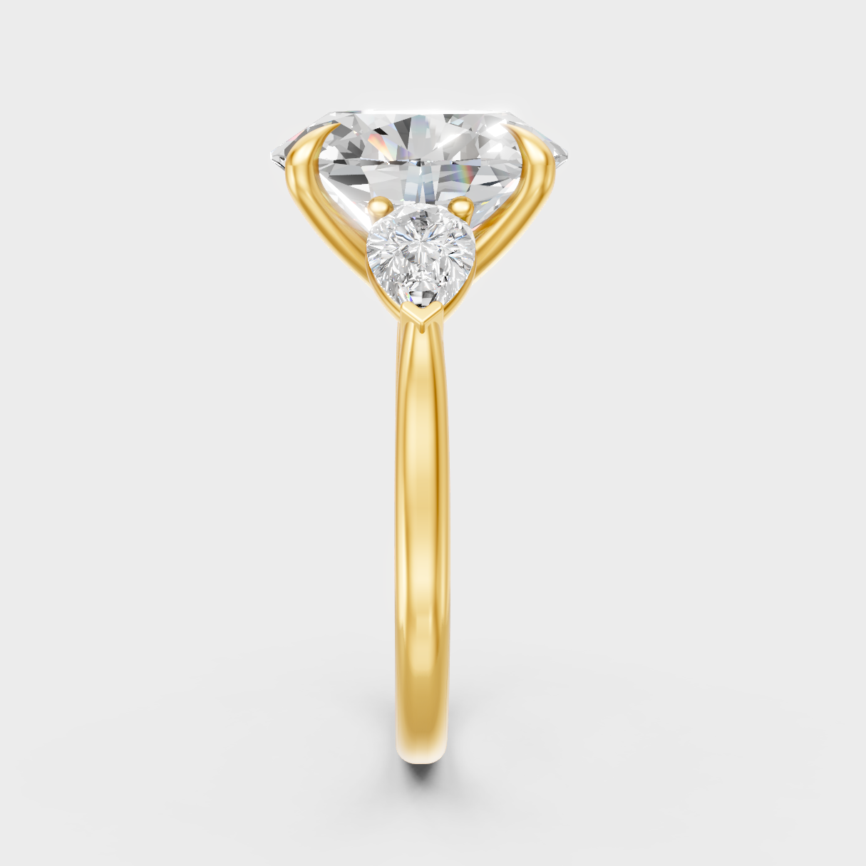 Sustainable Yellow Gold Ring Featuring Oval Diamond With Elegant Pear Accents