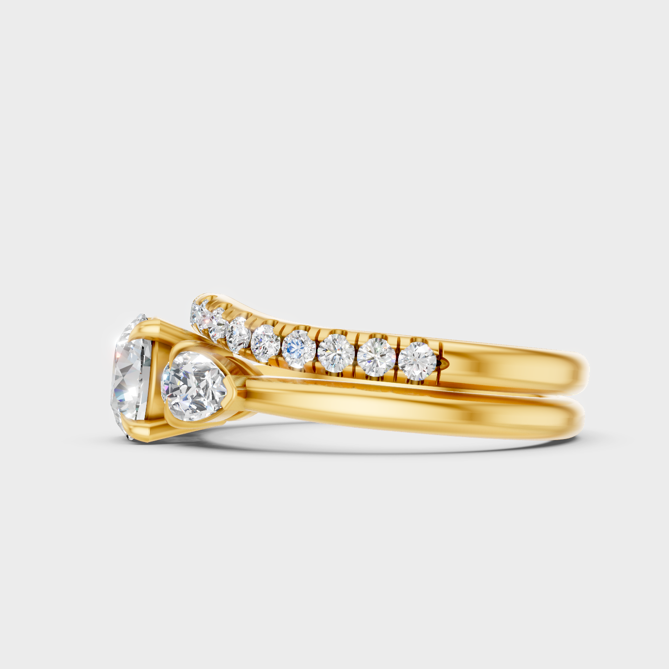 Sustainable Yellow Gold Ring Set Featuring Round Center And Pear Accents