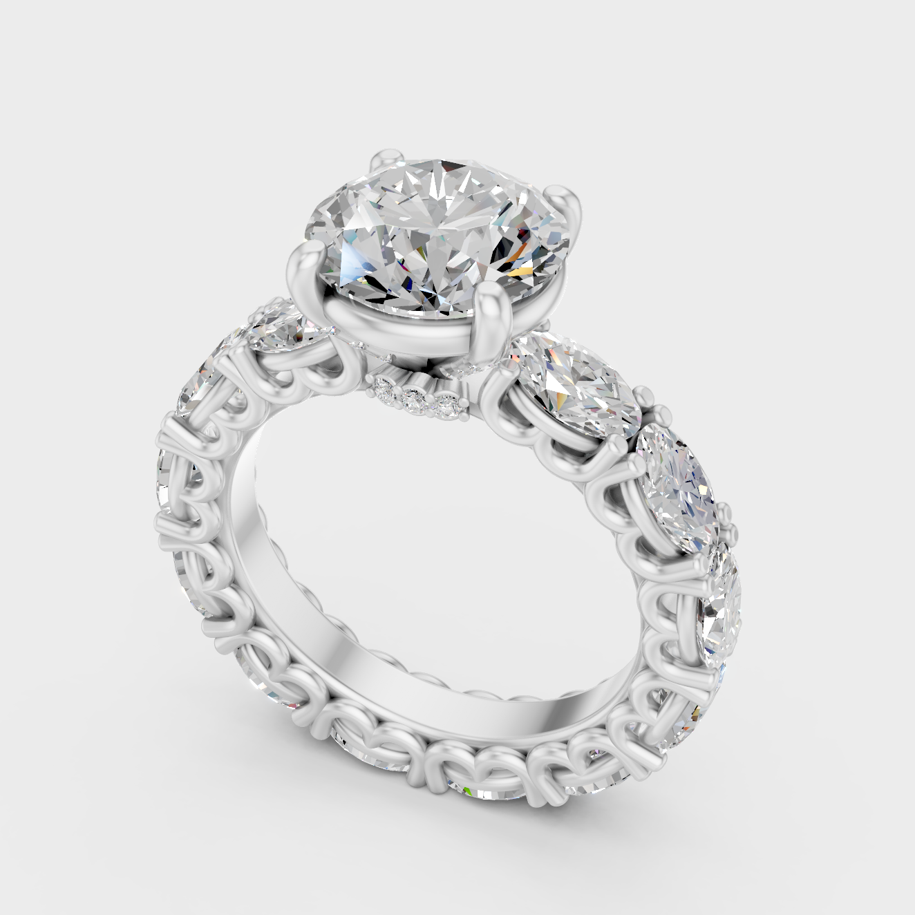 Platinum Engagement Ring With Round And Oval Diamonds