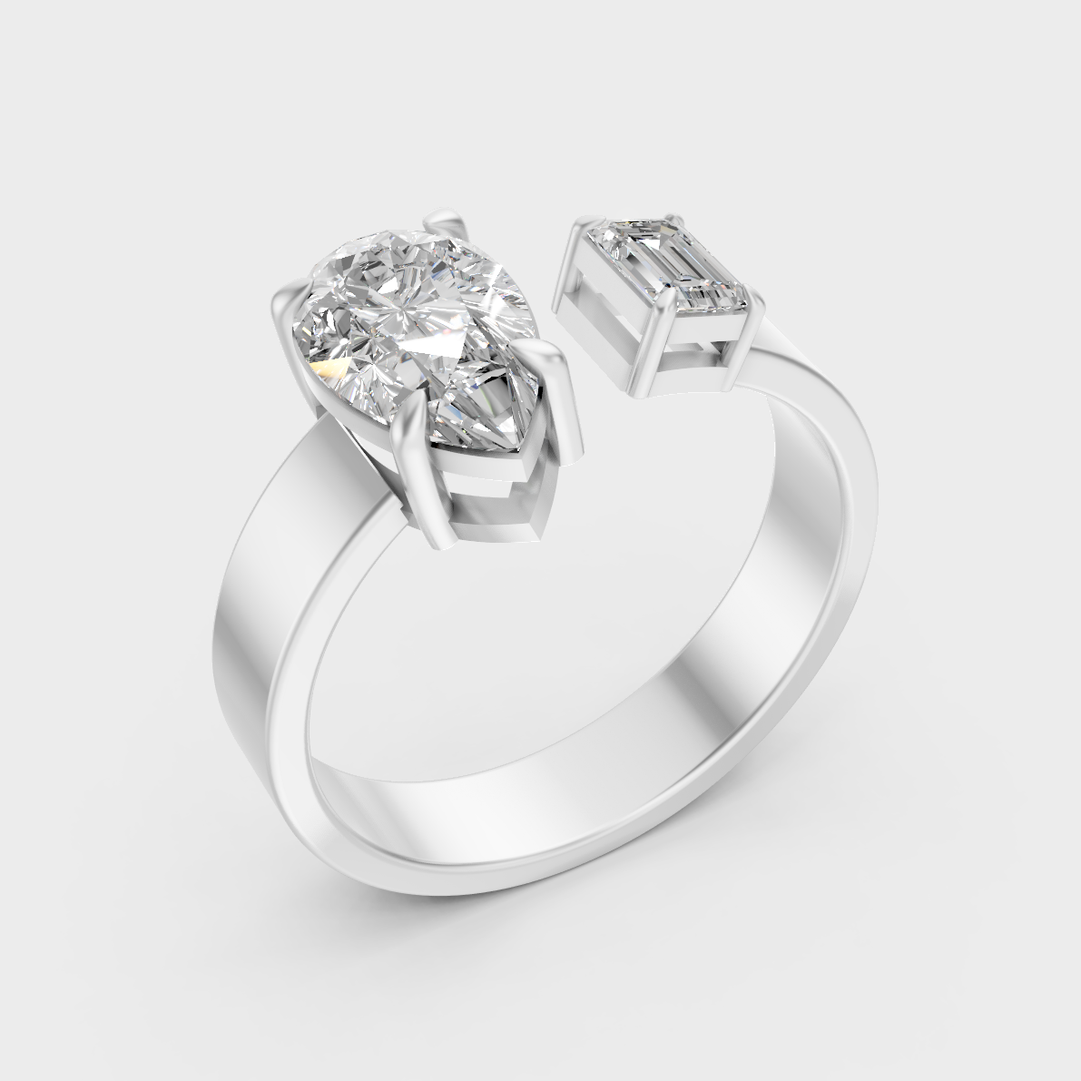 Platinum Two Stone Diamond Ring With Emerald And Pear Cut Diamonds